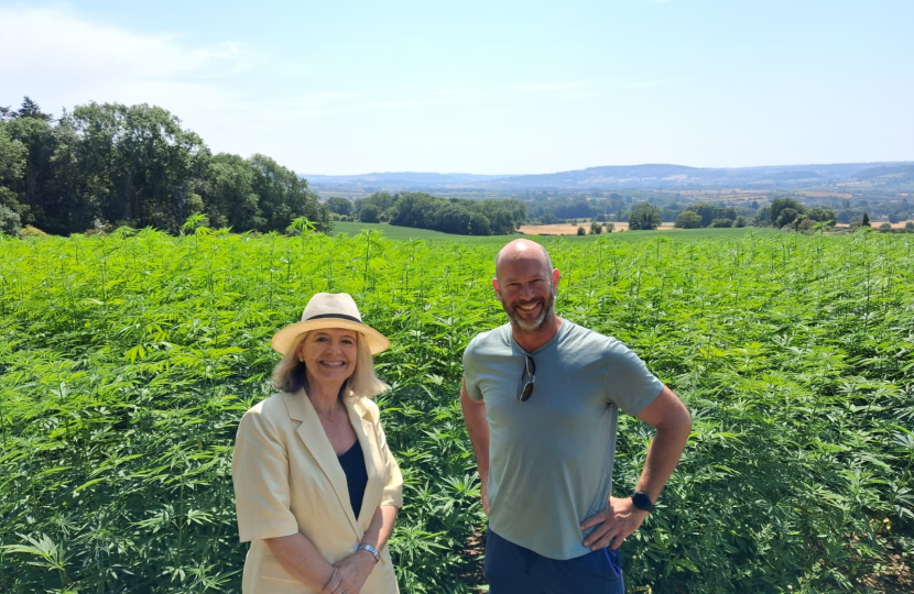 Dame Harriett Baldwin MP (left) with farmer Jake Freestone at his farm