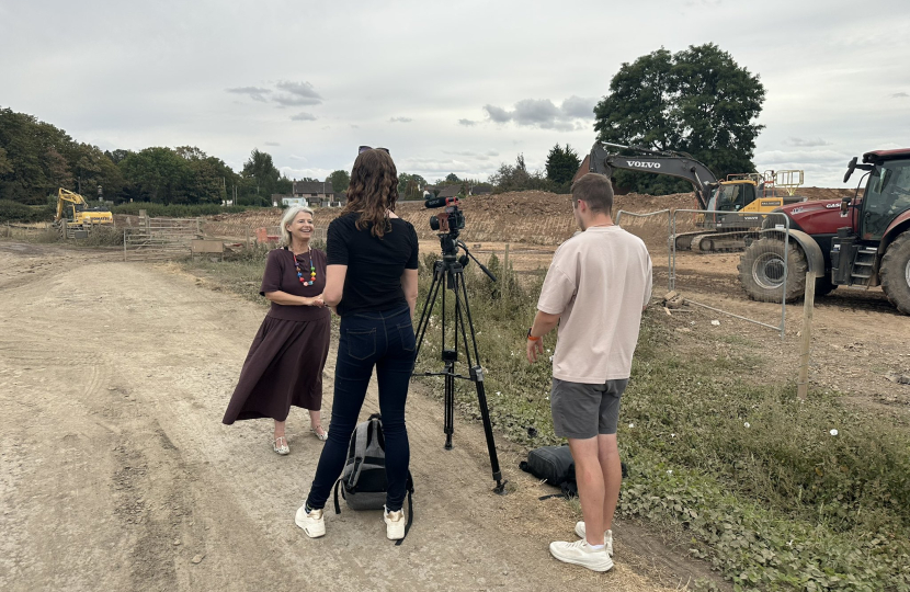 Dame Harriett being interviewed by ITV Central at the site of the Severn Stoke flood bund.