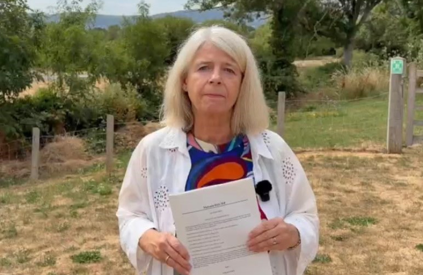 Dame Harriett Baldwin MP with a copy of the Malvern Hills Bill   