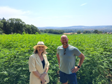 Dame Harriett Baldwin MP (left) with farmer Jake Freestone at his farm