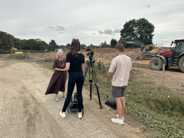 Dame Harriett being interviewed by ITV Central at the site of the Severn Stoke flood bund.